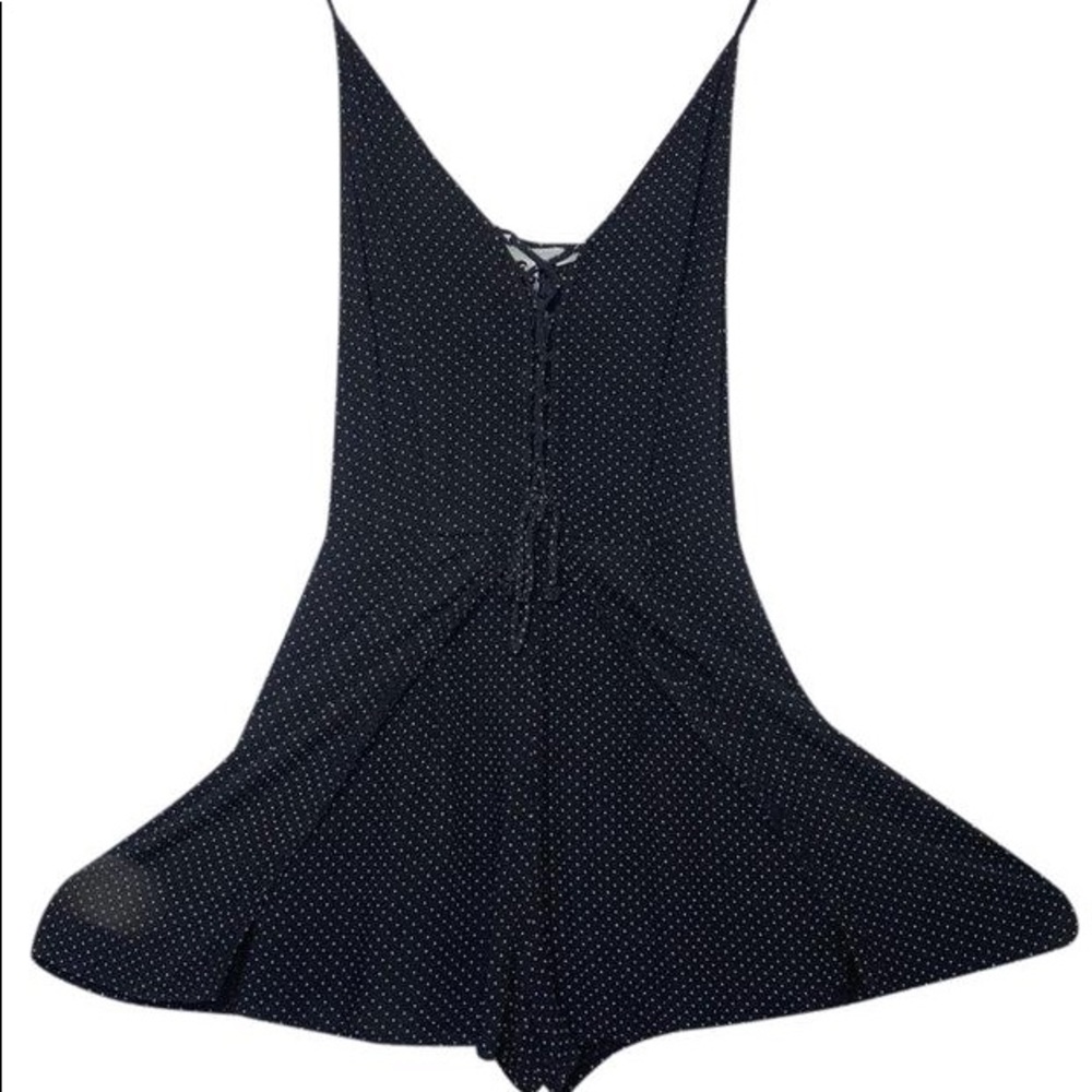 American eagle polka dot romper, black and white, crossed